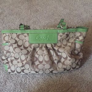 Green and tan Coach purse